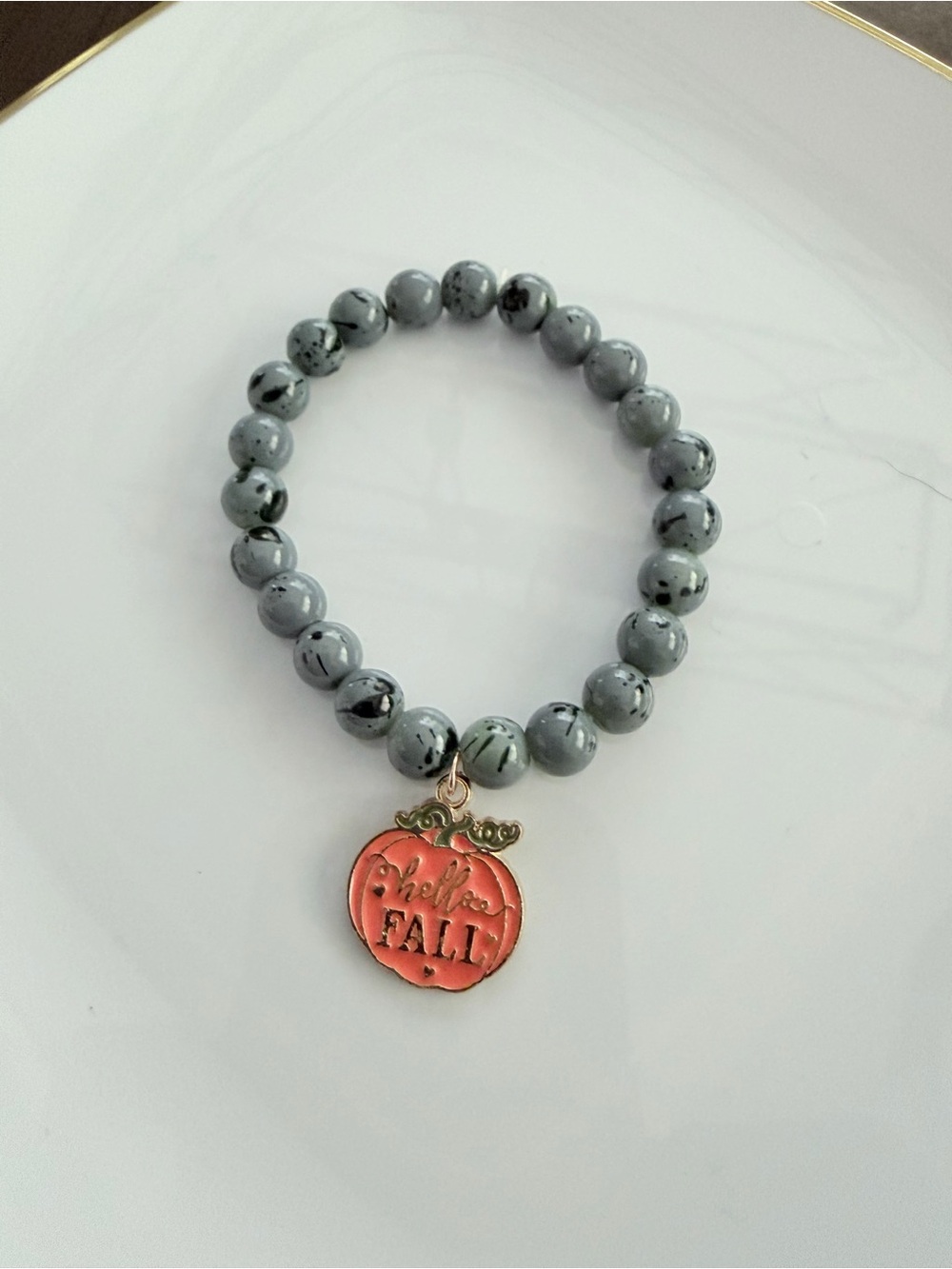 Gray Beaded Stretch Bracelet with Orange Pumpkin Charm